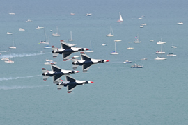 U.S. Air Force Thunderbirds flying over Lake Michigan with boats in the lake